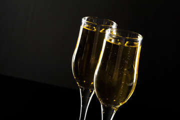 glass of champagne on black background