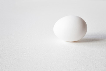 White egg on the table. Food concept. Empty place for a text.