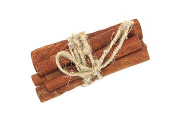 Cinnamon bark tied with rope isolated on white background. close-up. top view. 