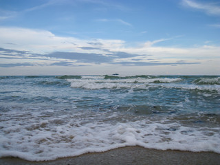 Ocean wave with cloudy and blue sky
