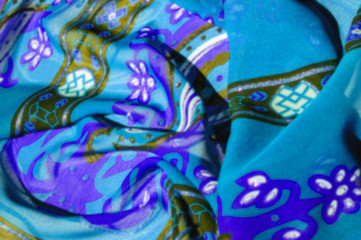 Background texture Blue silk fabric with a pattern. this light silk braided can be turned into your design. With the help of several segments from this print, you can get precious samples of your work