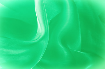 Texture, background, pattern. Green silk fabric for draping. Abstract Fabric, Artistic Waving Cloth...