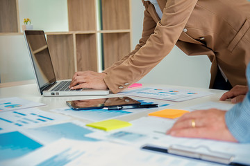 Business working at office with laptop and documents on his desk. Business concept.