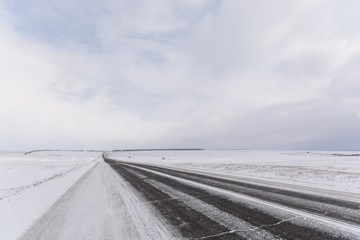 Winter landscape, road through the steppe
