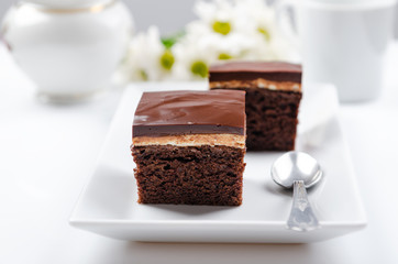 Dark chocolate cake with white cream