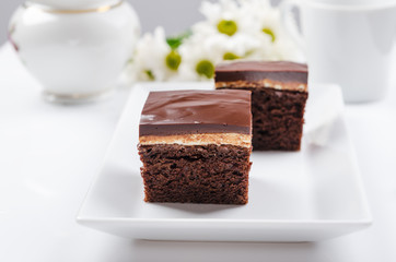 Dark chocolate cake with white cream