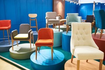 Chairs in salon of furniture - obrazy, fototapety, plakaty