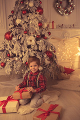 Young boy at home on Christmas evening