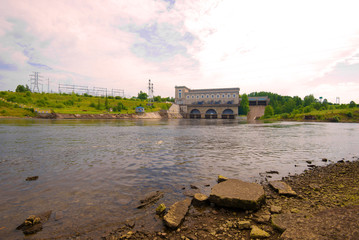 Fototapeta na wymiar Narva hydroelectric power station on a cloudy August evening. Ivangorod, Russia