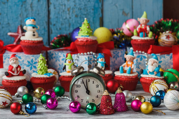 Christmas cupcakes with colored decorations made from confectionery mastic