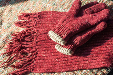 Texture, background, pattern. Warm winter woolen sweater. Scarf Gloves