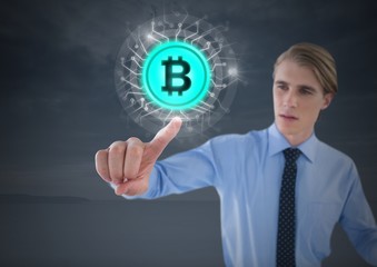 Businessman touching bitcoin graphic icon