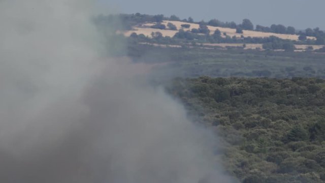 Hydroplane flying behind fire smoke