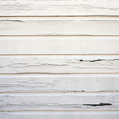 Obraz premium peeling white paint on horizontal wooden planks of shed wall
