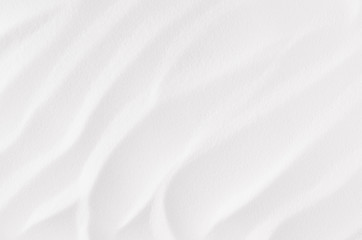 Fototapeta na wymiar White abstract grainy smooth wavy background.