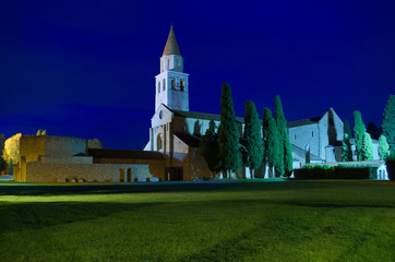 Night view of the Cathedral (Basilica) of Santa Maria Assunta in Aquileia at the blue hour, Friuli, Italy

