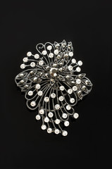 brooch with diamonds isolated on black background