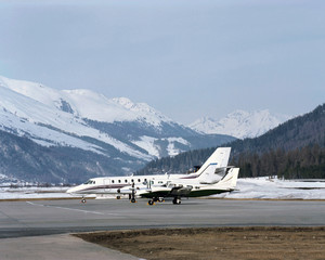 Fototapeta na wymiar Private jets and planes in the airport of St Moritz Switzerland