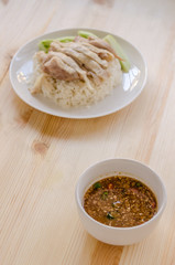 Hainanese chicken rice or rice cooked in chicken broth