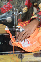 .Women are sewing