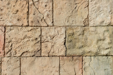 Stone wall of nude shades ideal for the background; Brick wall