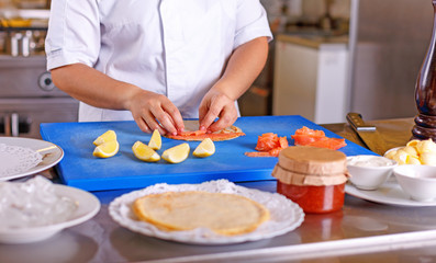 Obraz na płótnie Canvas Pancakes with salmon and caviar