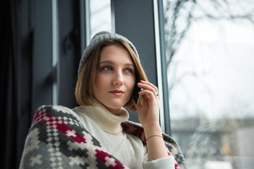 Woman talking by smartphone