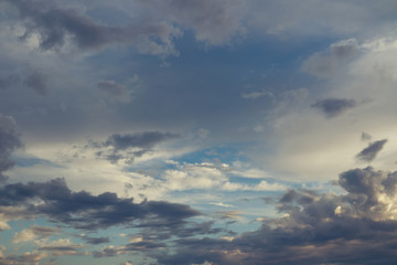 Rainy clouds flying over horizon at beautiful evening.
