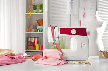 Tailor's workplace with modern sewing machine
