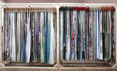 Assortment of fabric samples for curtains in shop