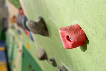 Climbing wall with artificial boulders, closeup
