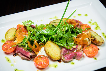 Chef s specialty presented in restaurant on served table