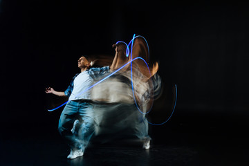 Movement is life. Pleasant nice delighted man smiling and enjoying his dance while standing against...