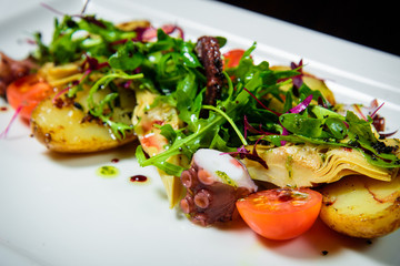 Chef s specialty presented in restaurant on served table