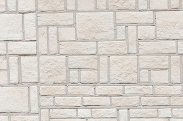 Texture, background, pattern. A wall made of natural sandstone. Wall of slate as texture background.marble texture decorative brick, wall tiles made of natural stone.