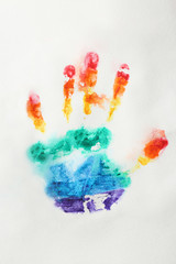 Naklejka premium Rainbow handprint on white background