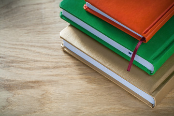 Vintage notepads on wooden board