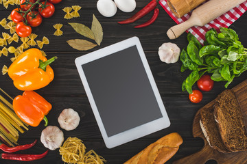 digital tablet and fresh ingredients