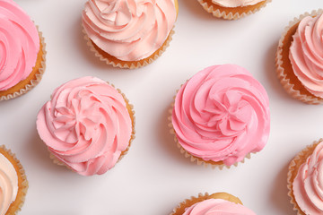 Many yummy cupcakes on white background