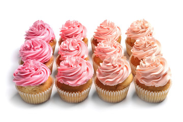 Many yummy cupcakes on white background