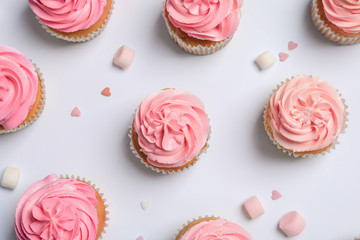Many yummy cupcakes on white background