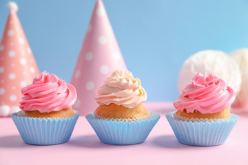 Yummy cupcakes on table