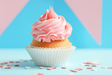 Yummy cupcake on blurred background