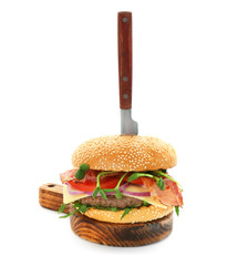 Board with tasty bacon burger, isolated on white