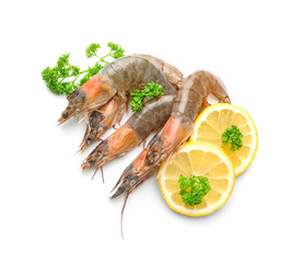 Fresh shrimps with slices of lemon on white background