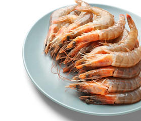 Plate with fresh shrimps on white background