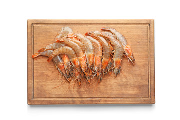 Wooden board with fresh shrimps on white background
