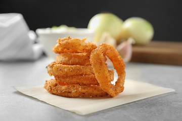 Fried onion rings on table
