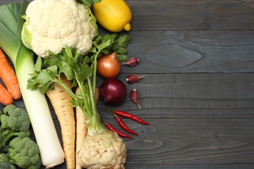 Fresh vegetables on dark wooden background. Mockup for menu or recipe. Top view with copy space