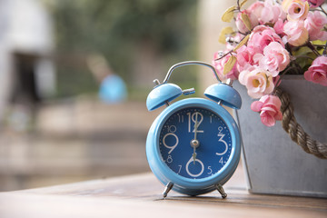 Blue clock with Artificial Flowers